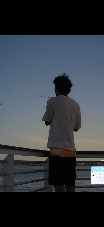 Founder fishing by the water